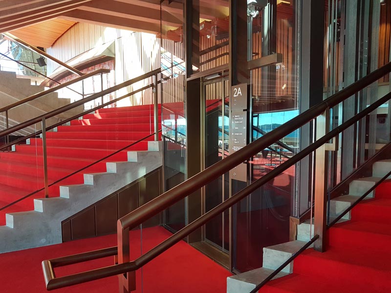 The exit from the glass elevator. Note the redesigned grip rails on the stairs for comfortable holding The exit from the glass elevator. Note the redesigned grip rails on the stairs for comfortable holding